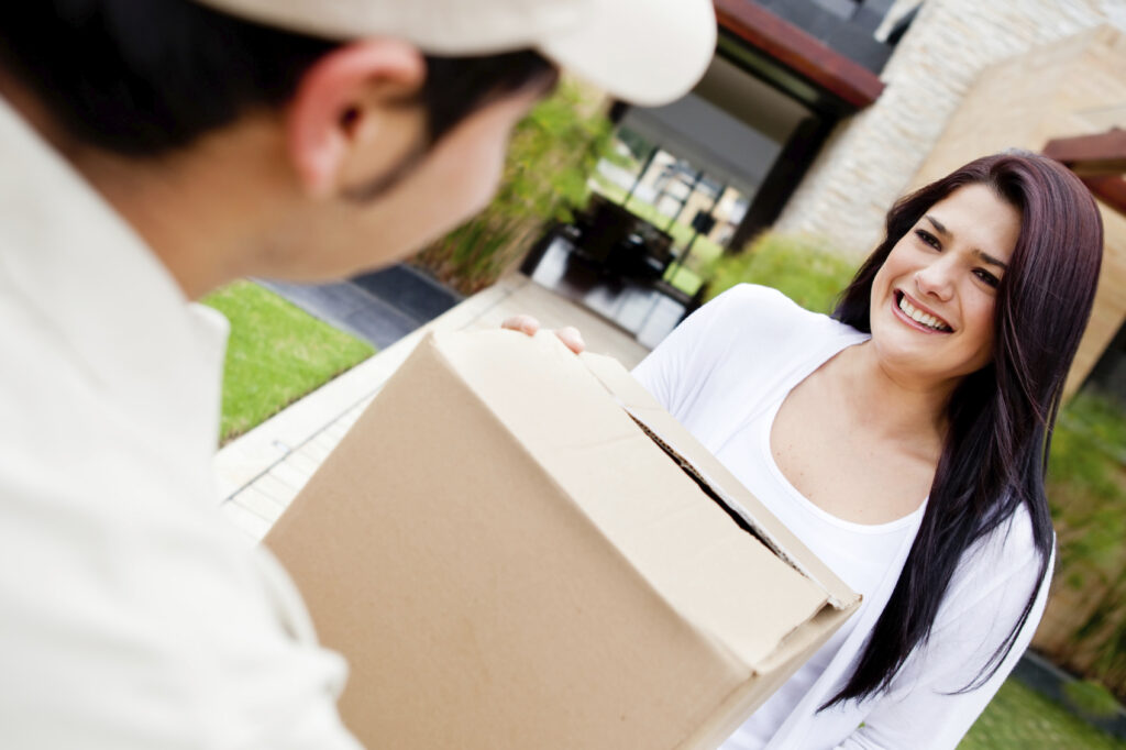 Drivas Recruitment - Mailman delivering a parcel